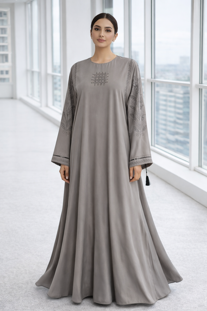 Luxury grey premium Nida abaya featuring full flare silhouette with elegant cut-work embroidery on sleeves, modest designer abaya by RUHKÉ
