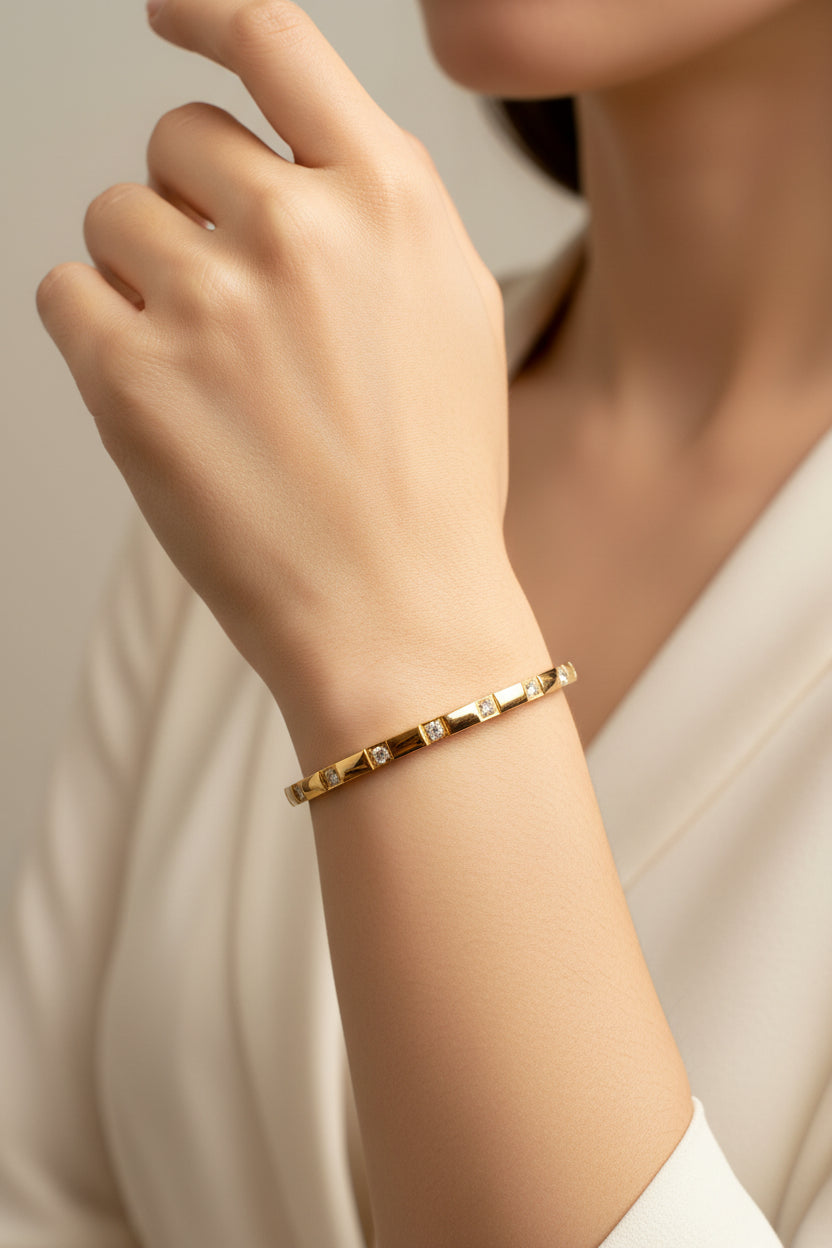 18K gold plated stainless steel bangle with polished luxury finish