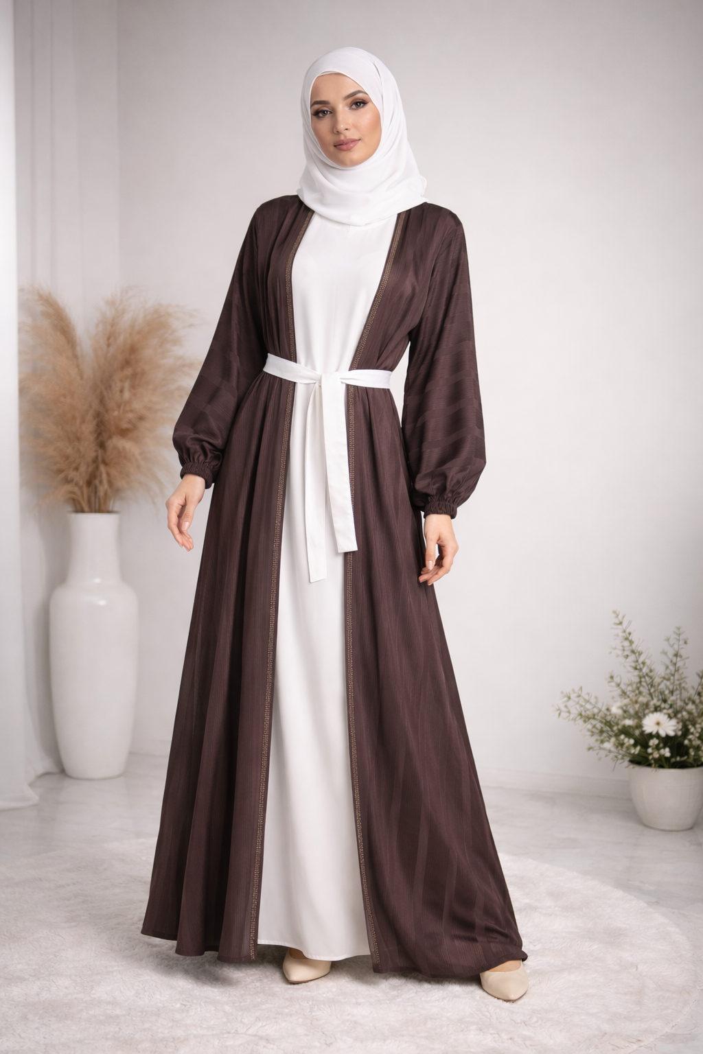 Model wearing luxury brown textured open abaya with inner dress and white Korean silk crêpe hijab