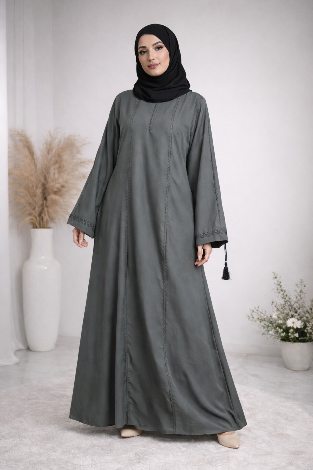 Model RUHKÉ luxury olive grey stone-work abaya featuring premium nida fabric and tassel sleeve detailing 