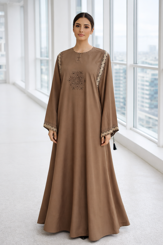 Elegant black abaya featuring gold embroidery and intricate stone embellishment, luxury modest wear by RUHKÉ