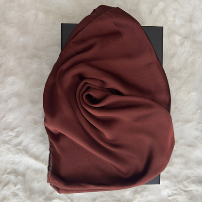 Close-up of brown Korean silk satin crêpe hijab fold drape, highlighting smooth luxury finish by RUHKÉ™