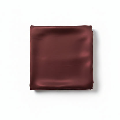 Brown satin crêpe Korean silk hijab folded neatly, showcasing premium fabric texture by RUHKÉ™