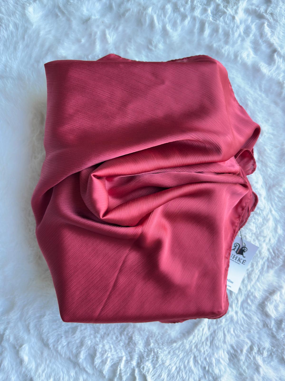 Close-up of rosewood blush Korean silk satin crêpe hijab fold drape, highlighting smooth luxury finish by RUHKÉ™