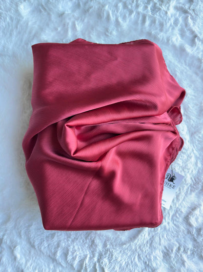 Close-up of rosewood blush Korean silk satin crêpe hijab fold drape, highlighting smooth luxury finish by RUHKÉ™
