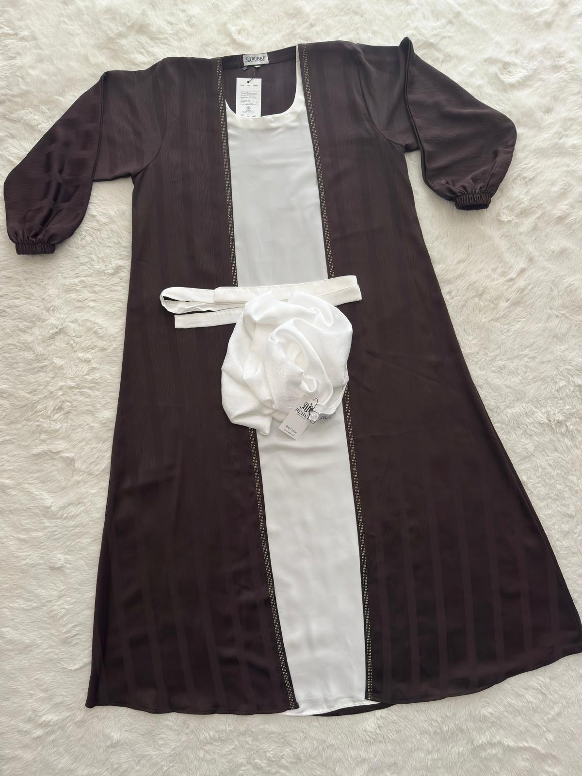 Close-up of textured crinkle crepe silk blend fabric on brown open abaya