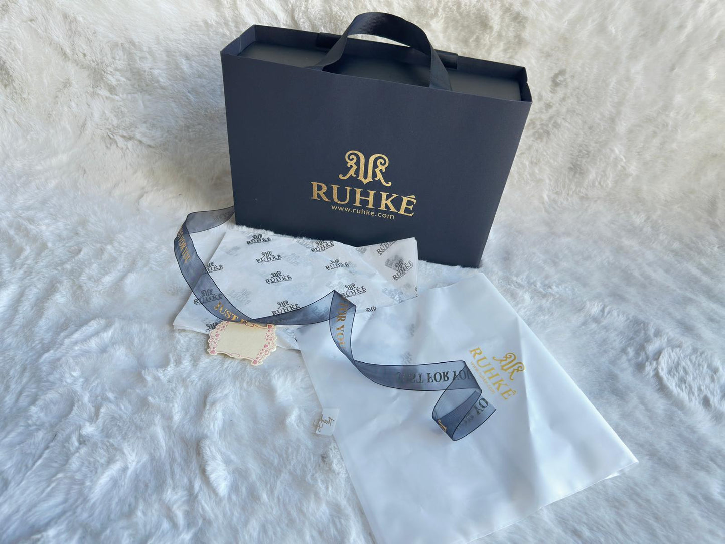 Premium RUHKÉ branded packaging for abayas, hijabs, and jewelry