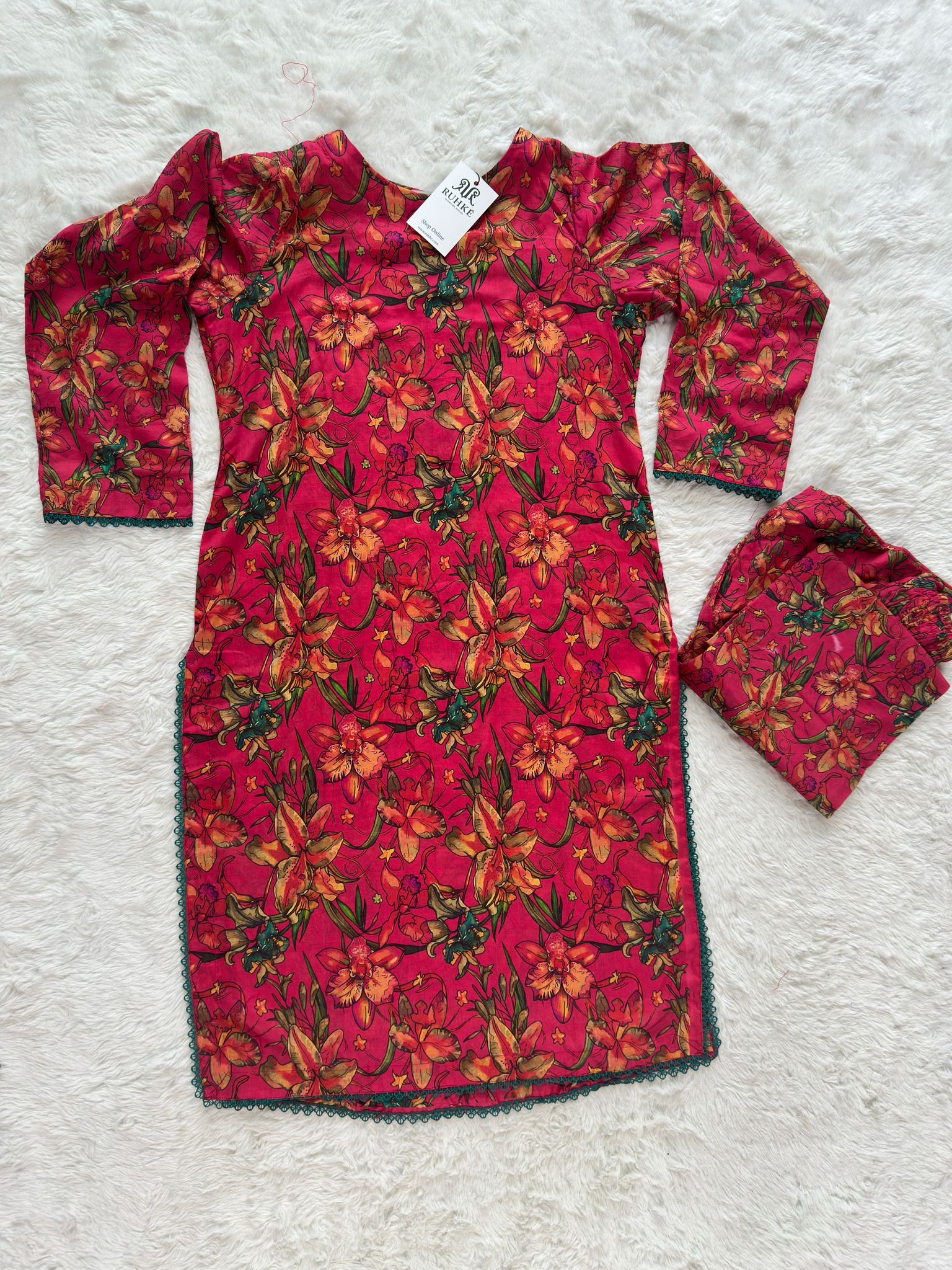 Flat lay of luxury printed lawn 2 piece suit including shirt and trouser