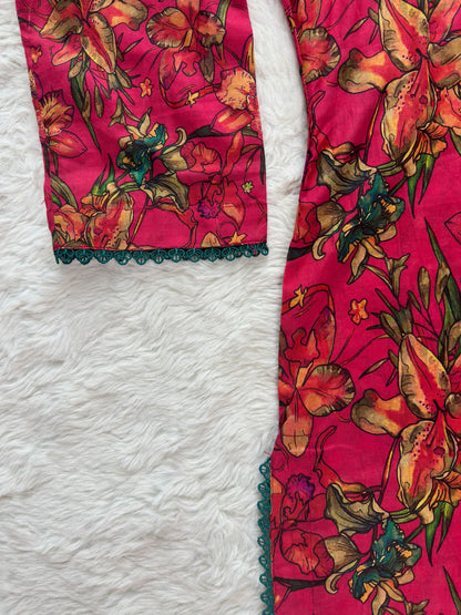 Close-up of contrast lace detailing on printed lawn shirt sleeves