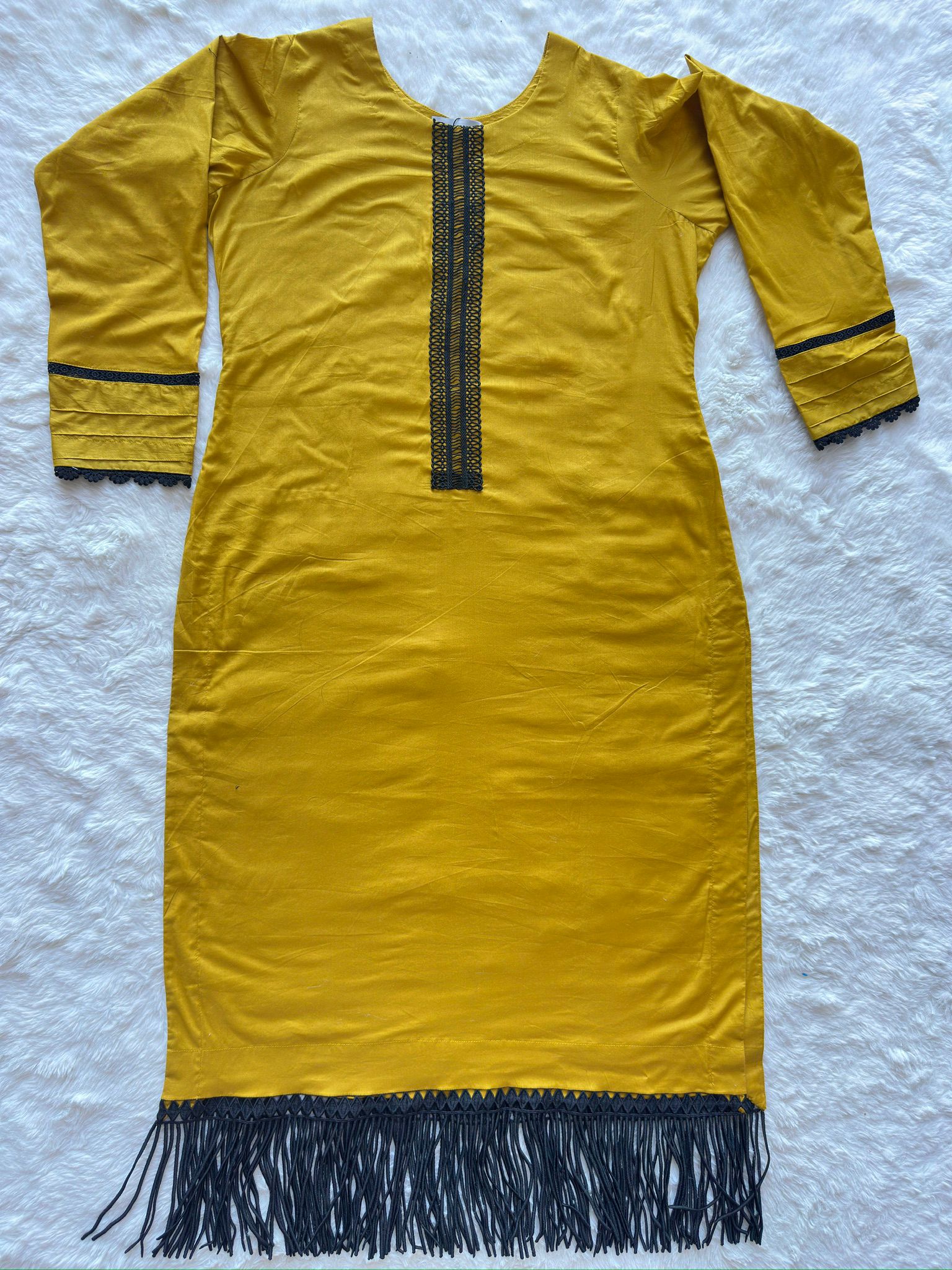 Mustard yellow long lawn shirt with straight cut silhouette flat lay