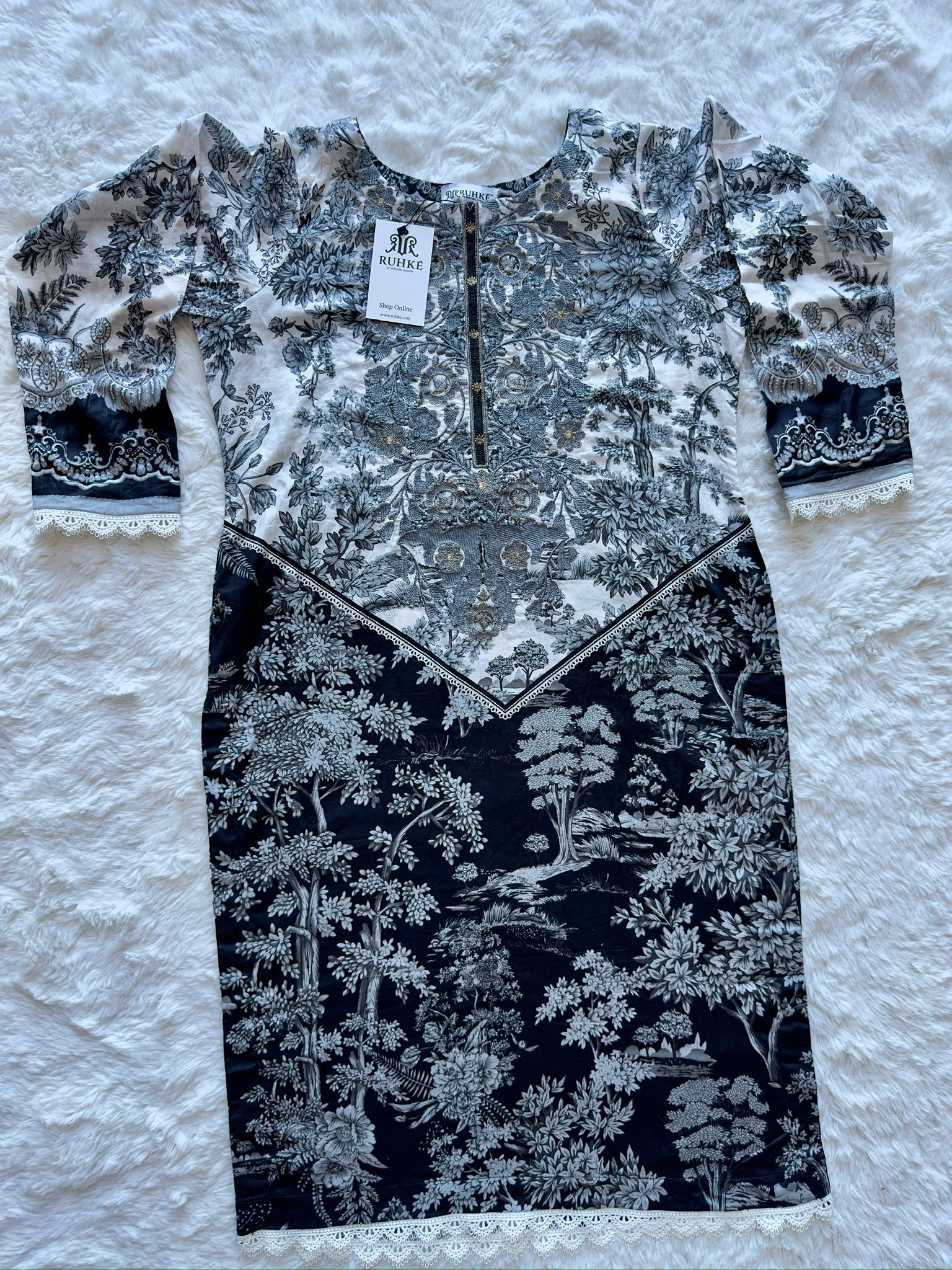 Front embroidery detail on printed lawn shirt with lace trim shirt