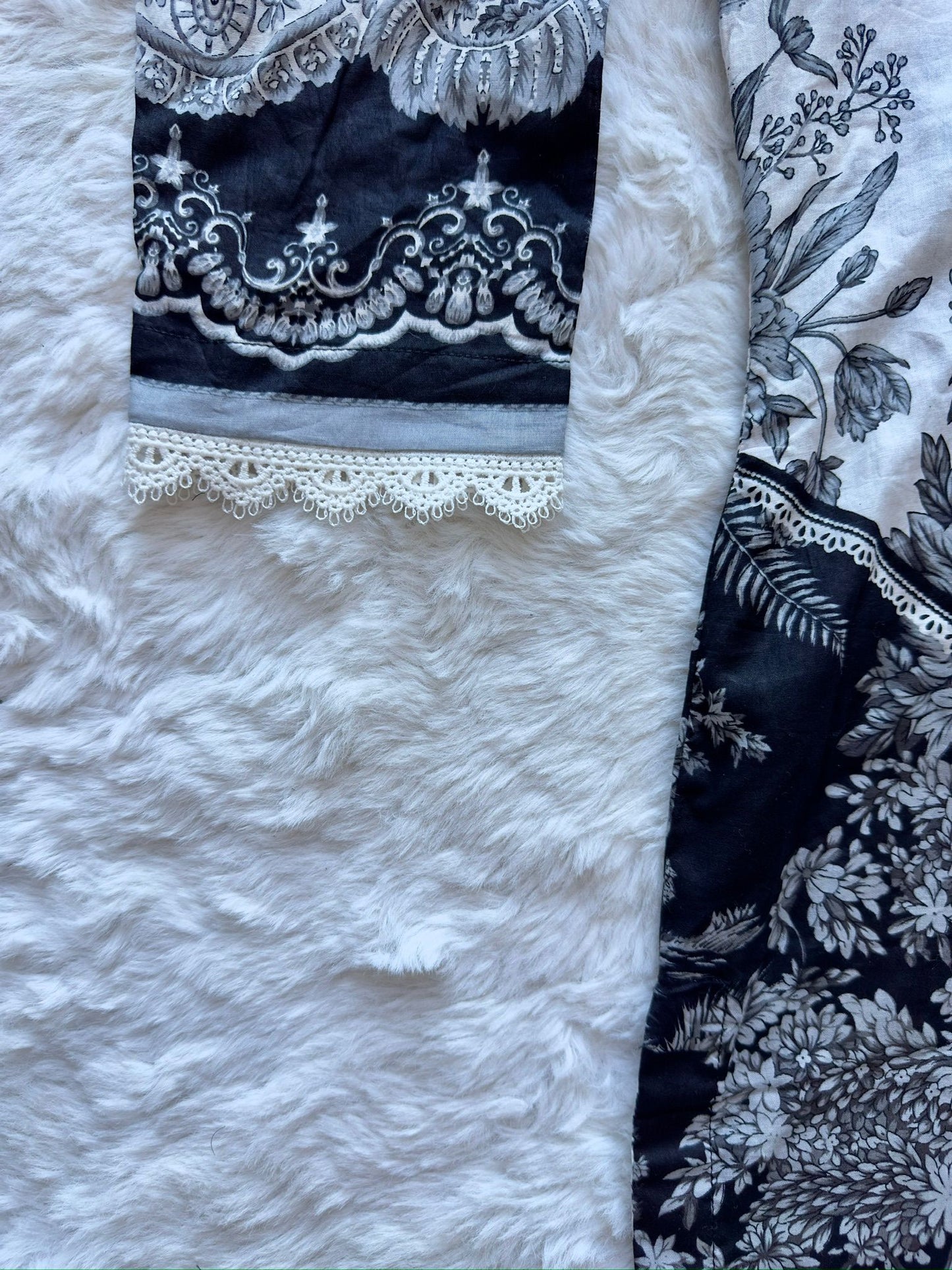 Lace detailing on lawn shirt sleeve close-up