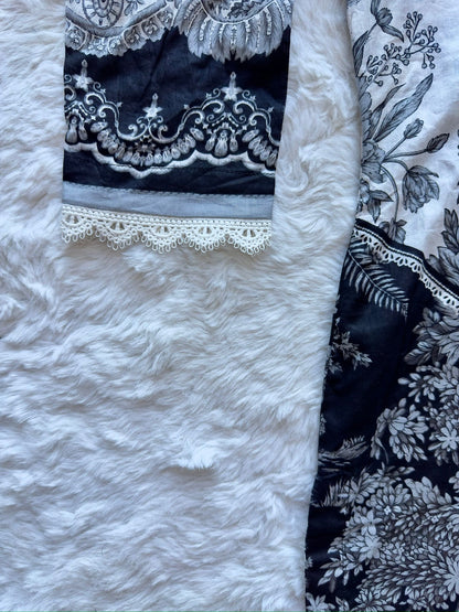 Lace detailing on lawn shirt sleeve close-up