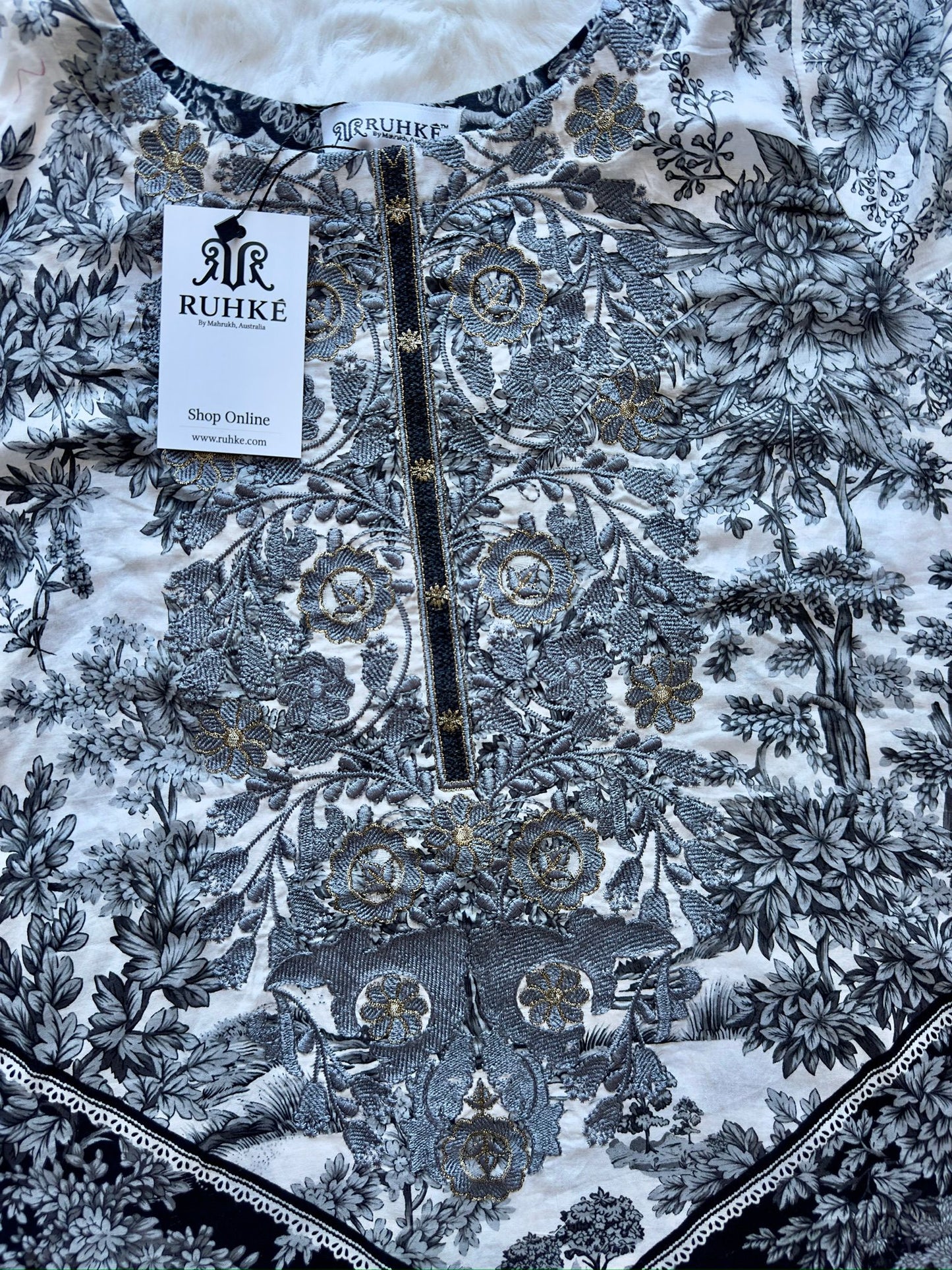 Lace detailing on lawn shirt front close-up