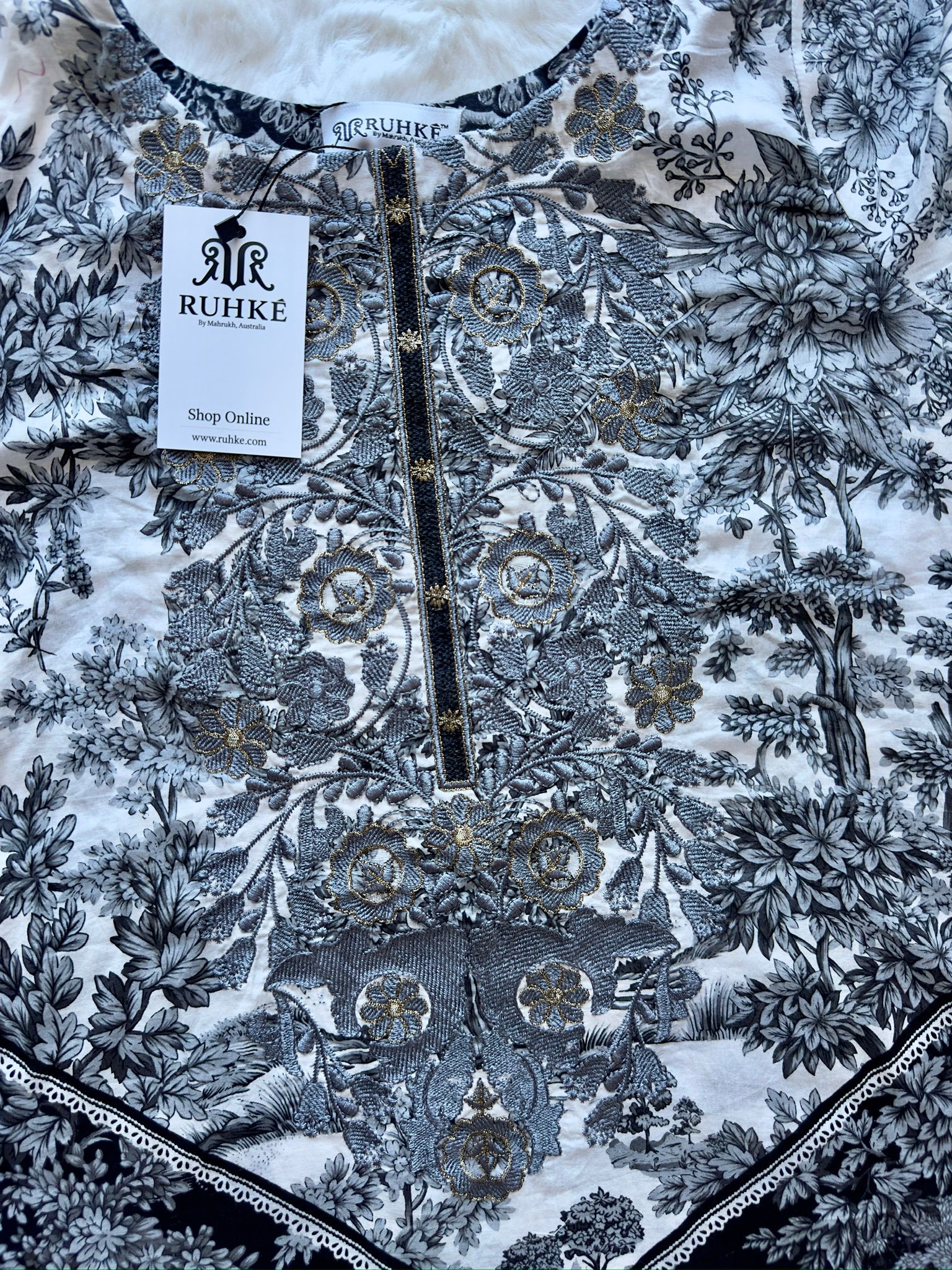 Lace detailing on lawn shirt front close-up