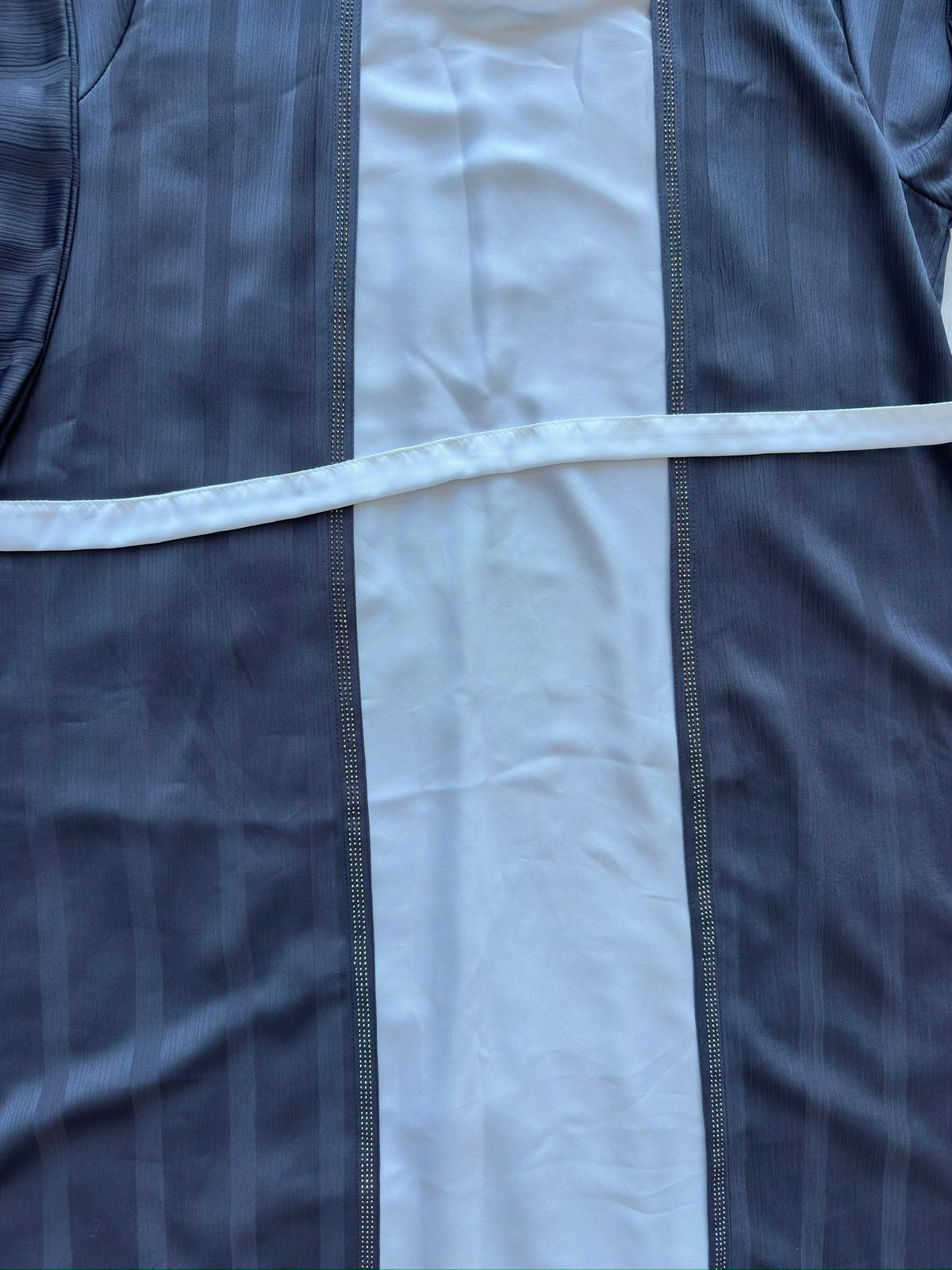 High-end charcoal grey flared silk abaya showcasing luxury texture and elegant flow stone work