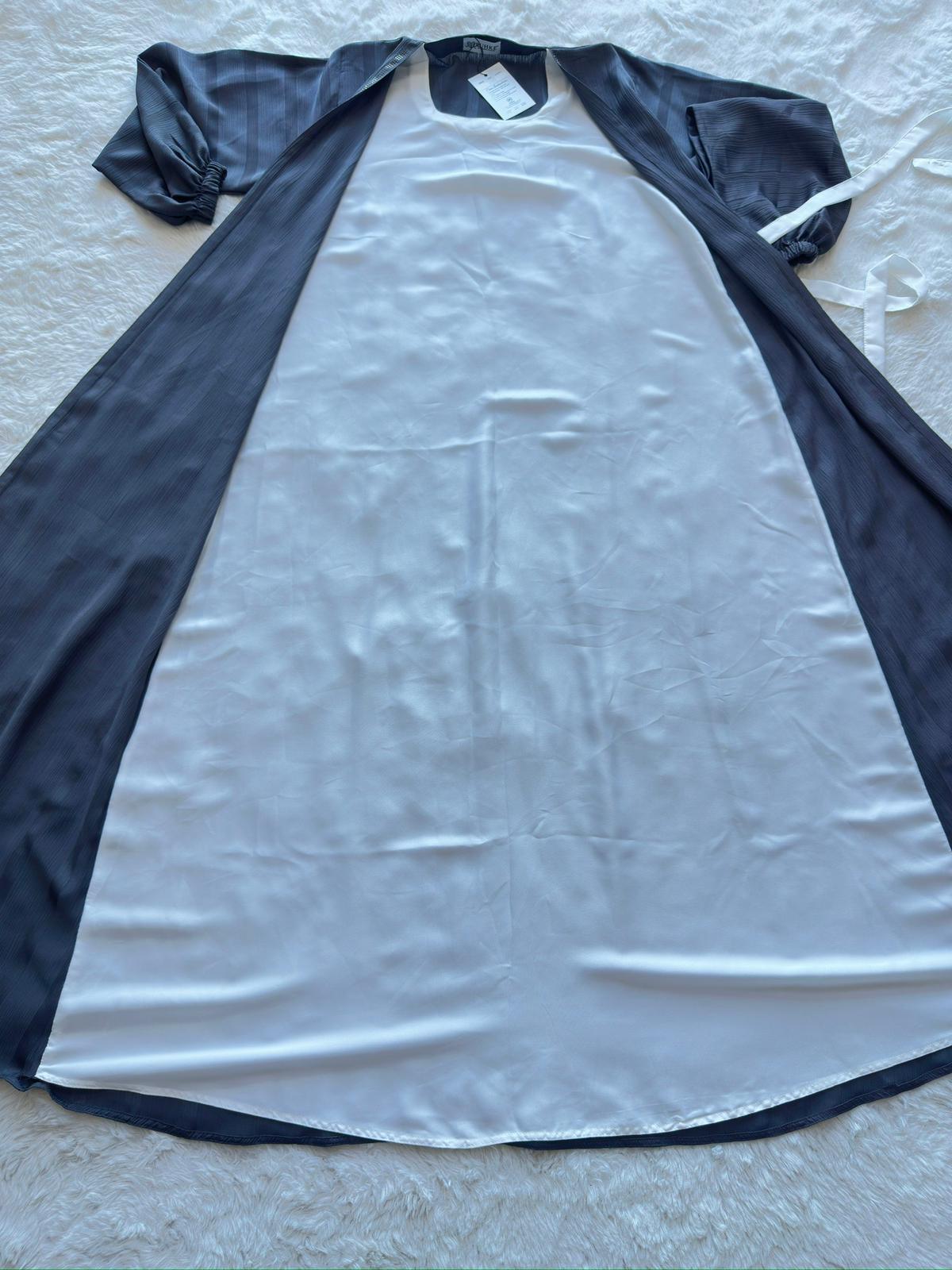 Luxury modest abaya in charcoal grey textured silk with flowing silhouette and premium finish attached inner