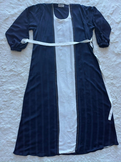 Royal navy textured silk abaya featuring a flowing silhouette and refined luxury finish by RUHKÉ Australia