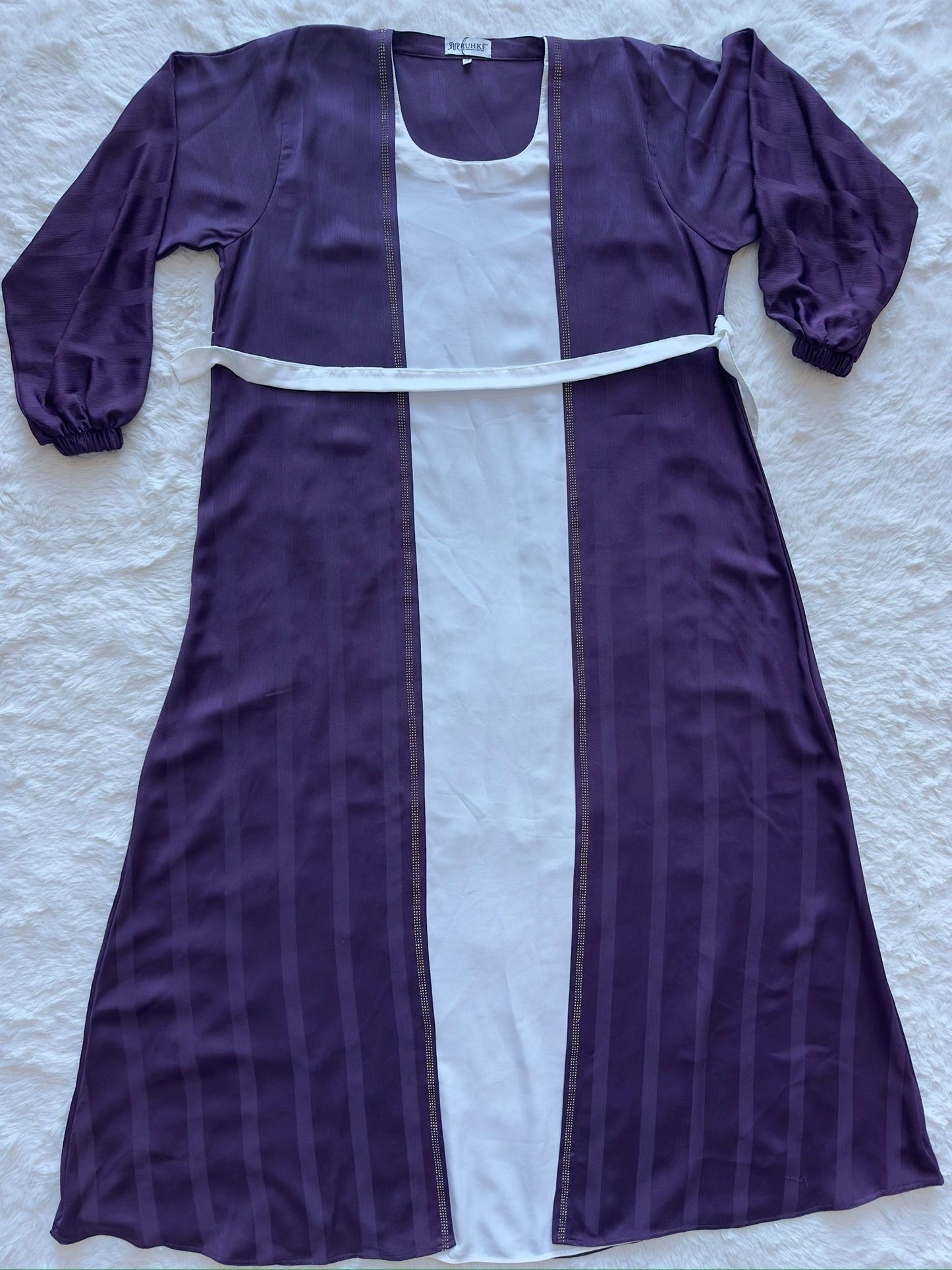 Deep plum textured silk flared abaya for women, designer modest fashion with graceful drape flat lay