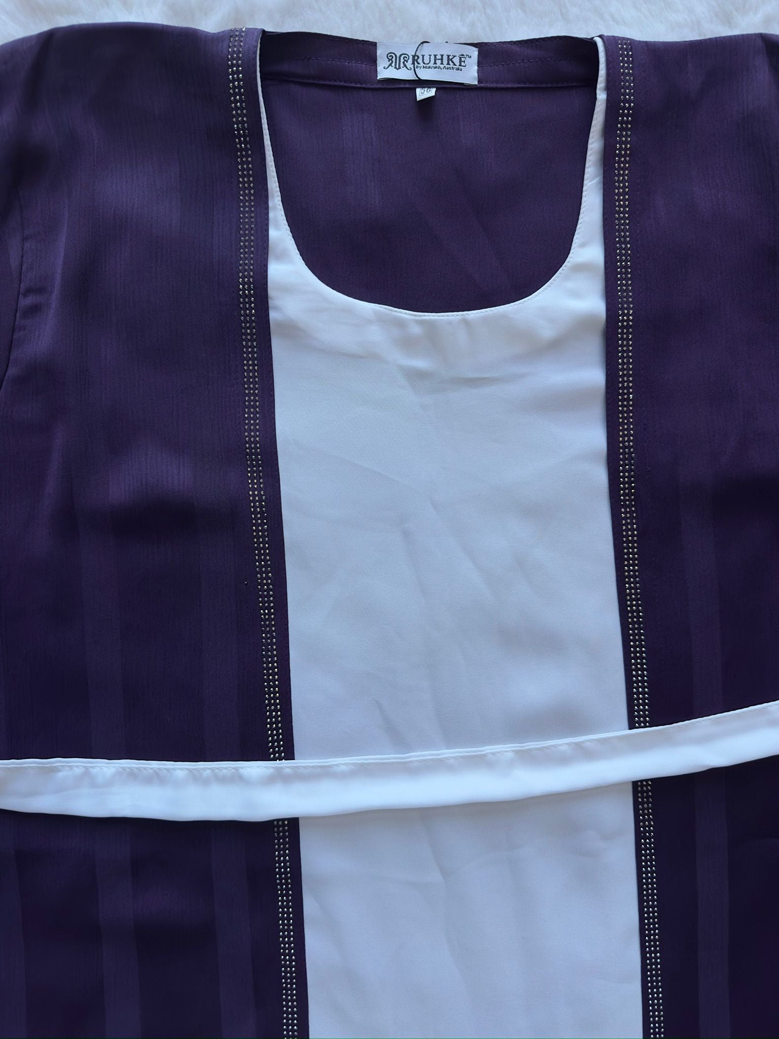 Designer deep plum textured silk abaya with refined flare cut, luxury modest wear neck stone work