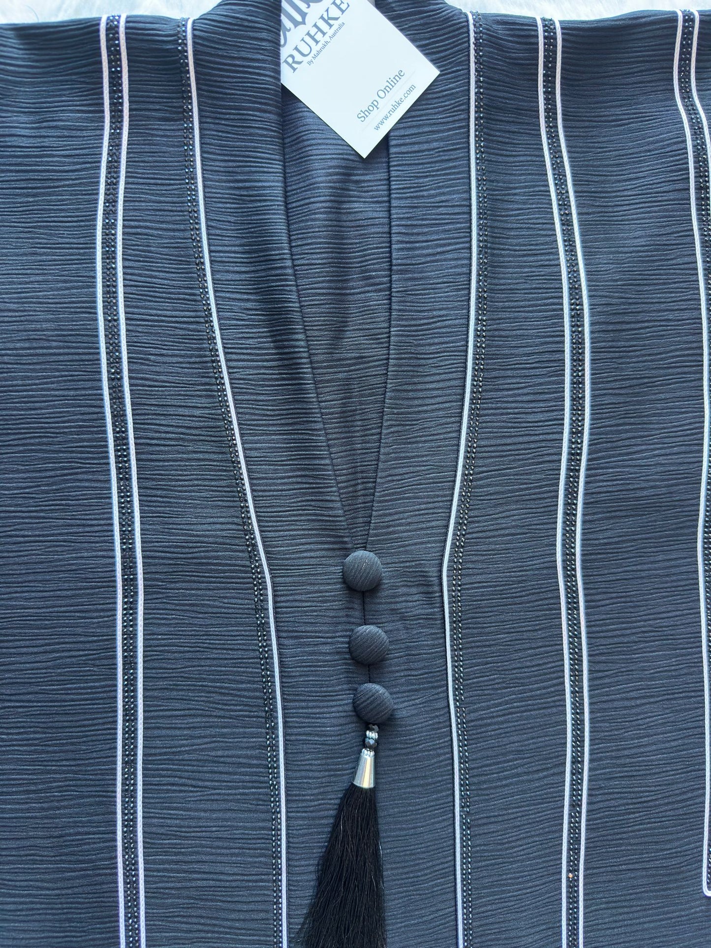 Luxury designer black silk abaya with intricate dori craftsmanship and stone work