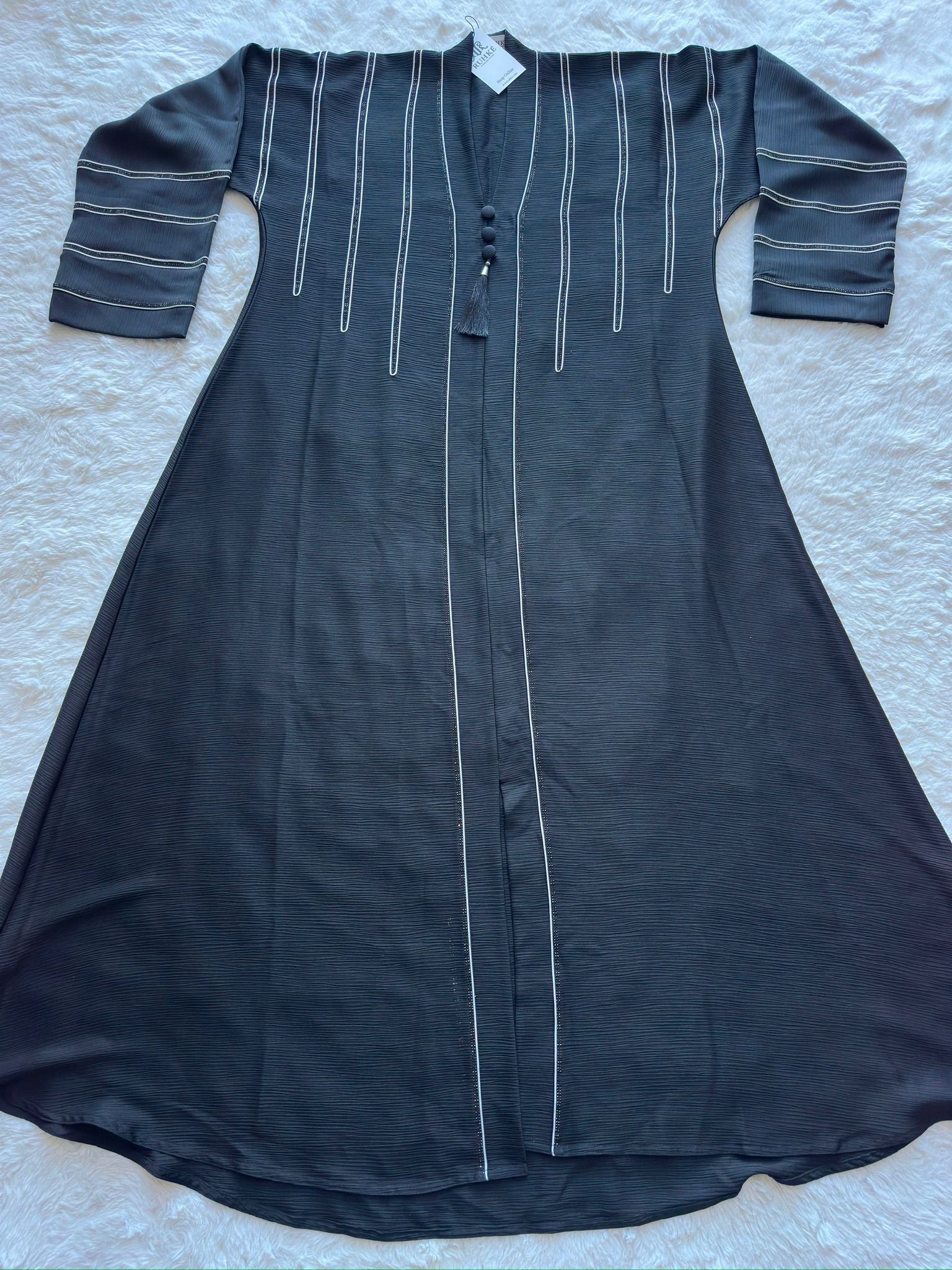 Designer black crêpe silk abaya featuring flared silhouette with handcrafted dori and stone detailing