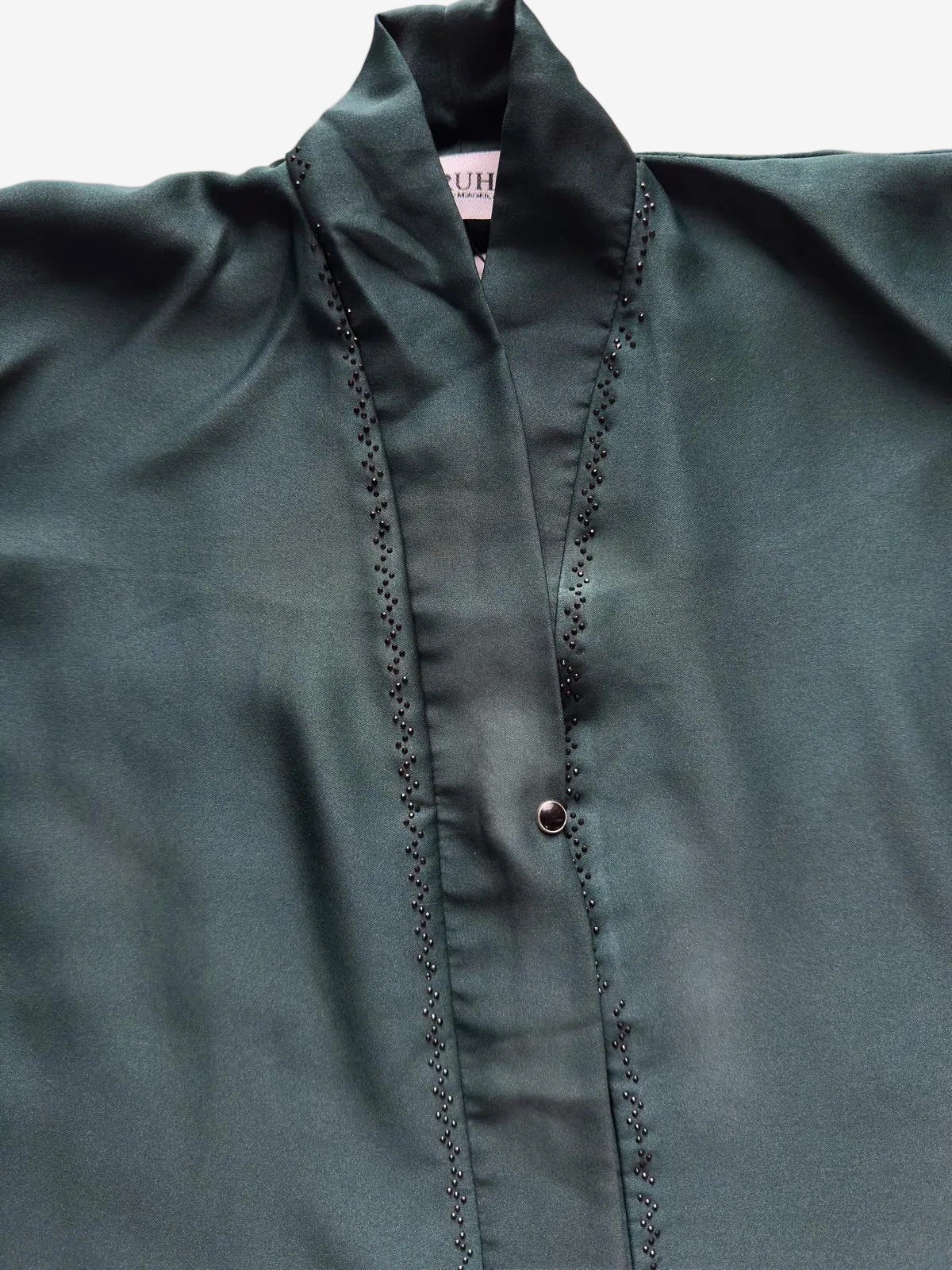 Elegant front open abaya featuring reverse U stone design and refined embellishment, luxury modest wear RUHKÉ