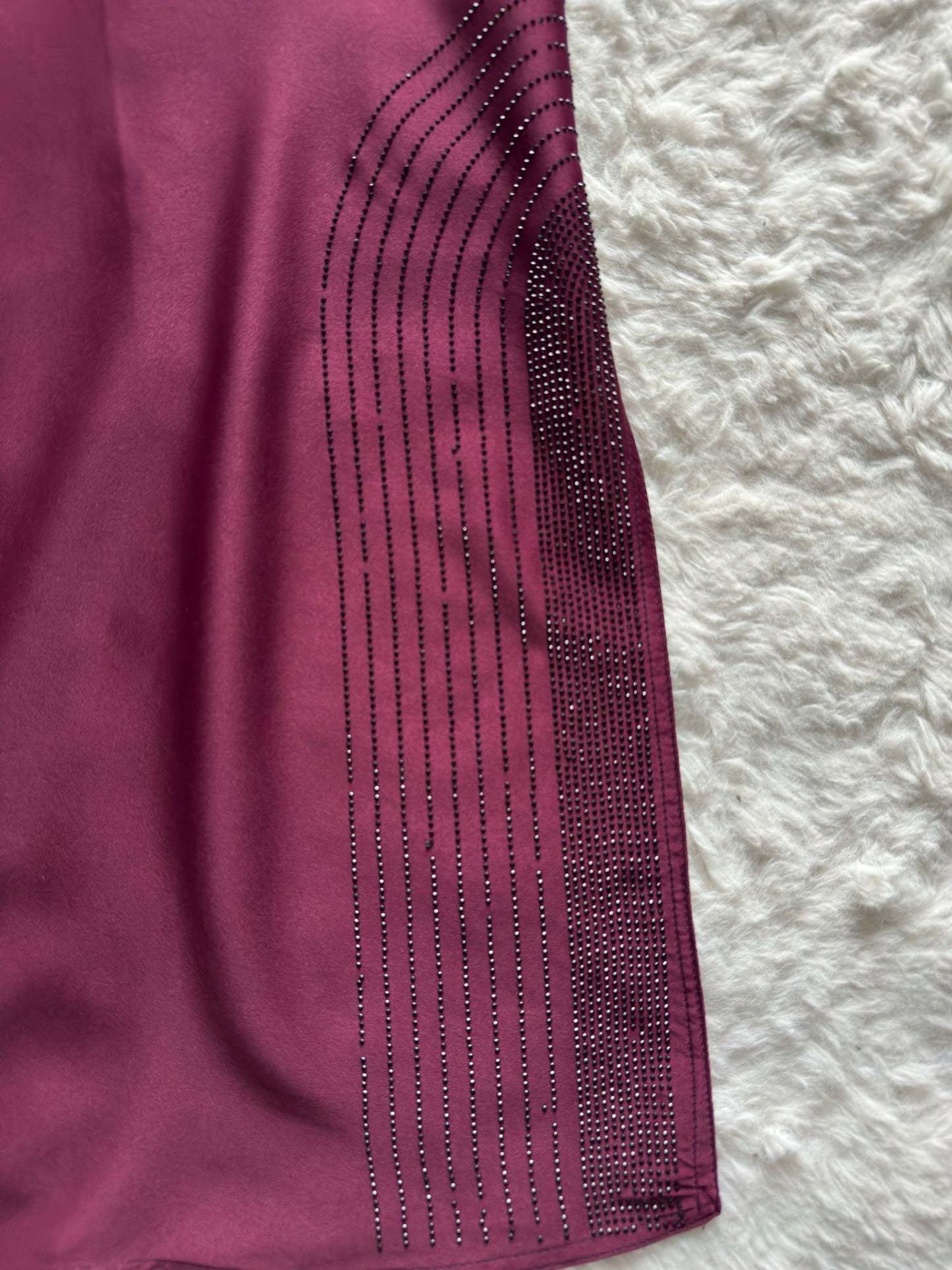 Formal black abaya with reverse U stone embellishment and detailed sleeve accents