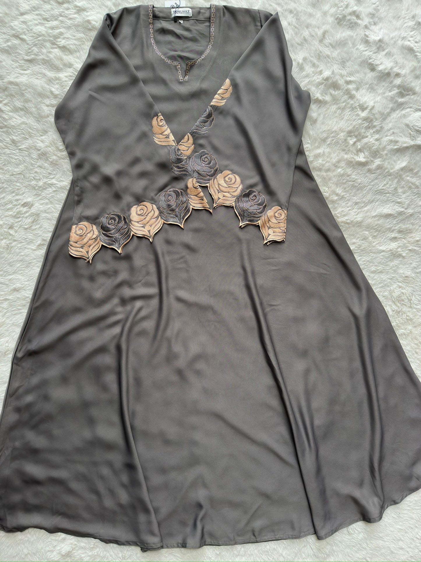 Elegant grey nida abaya featuring intricate thread embroidery and stone embellishment on cut-work sleeves