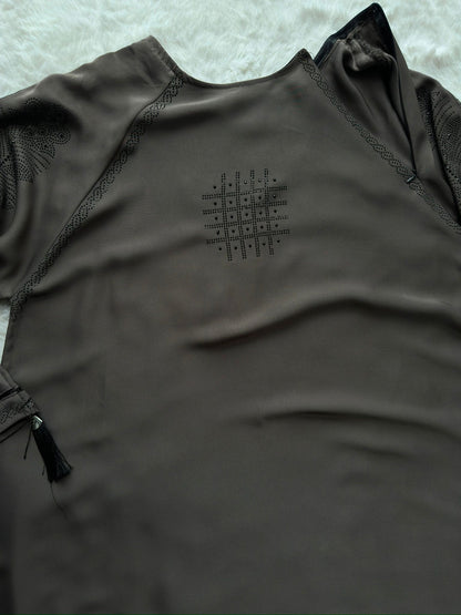 Close-up of embroidered cut-work sleeve detailing on luxury grey premium Nida abaya