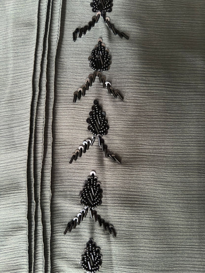 Full length sage green abaya with elegant black bead detailing