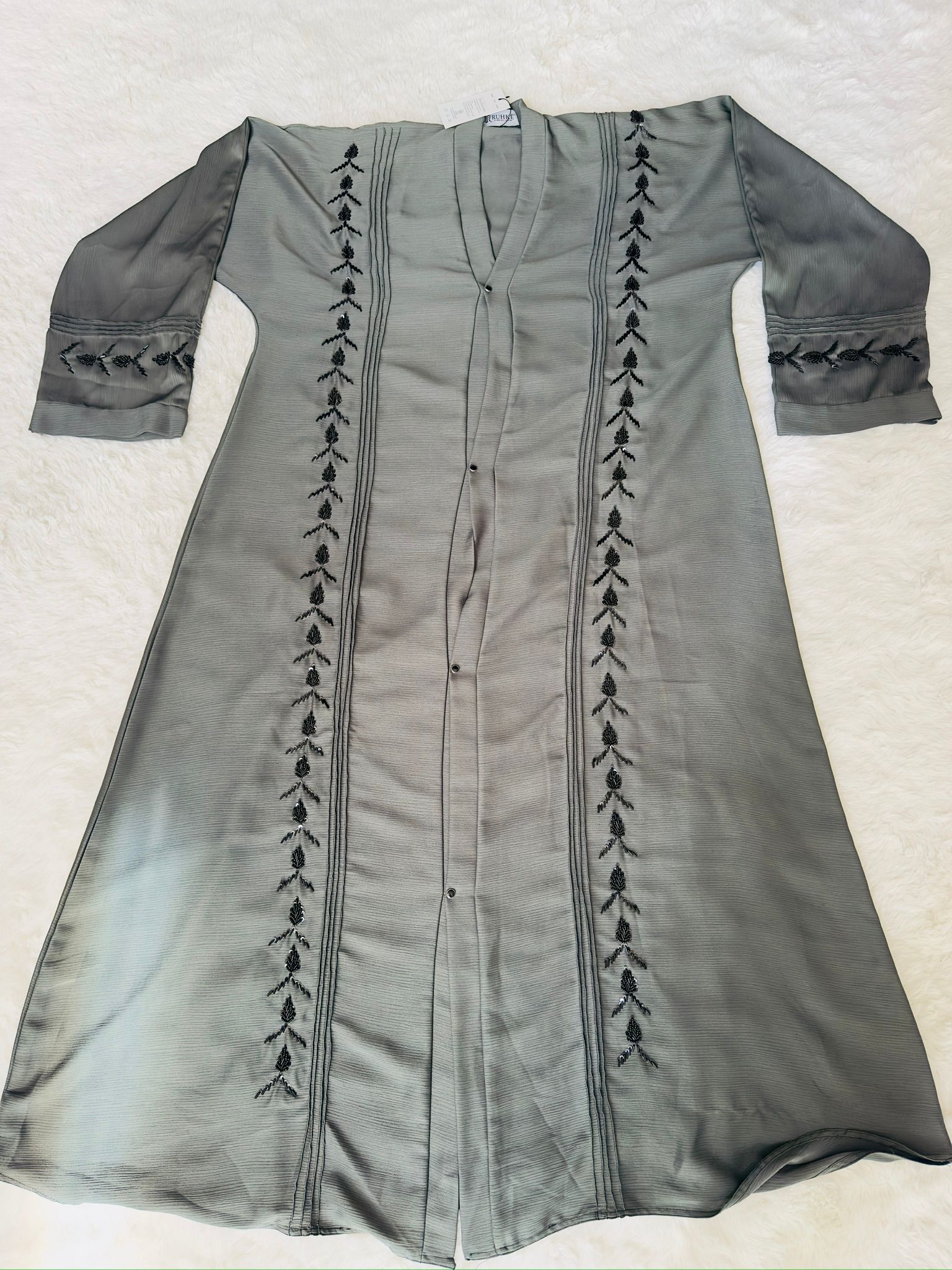 Luxury sage green embroidered abaya with detailed front beadwork