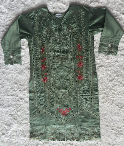 High-end sage green kurta set with detailed cut-work embroidery, delicate zari accents and luxury organza net dupatta by RUHKÉ