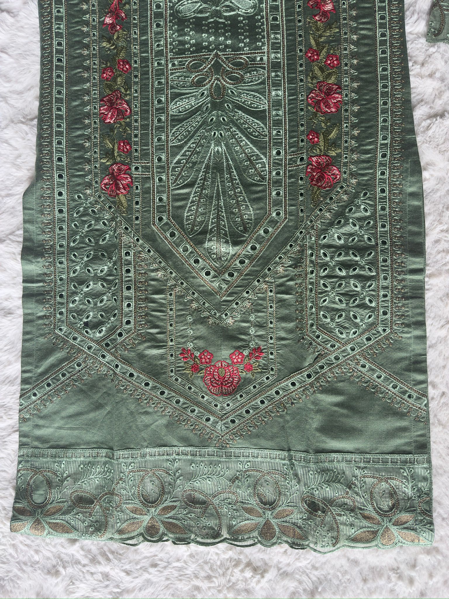 Designer sage green kurta with handcrafted cut-work, floral thread embroidery and zari work, finished with an organza net dupatta