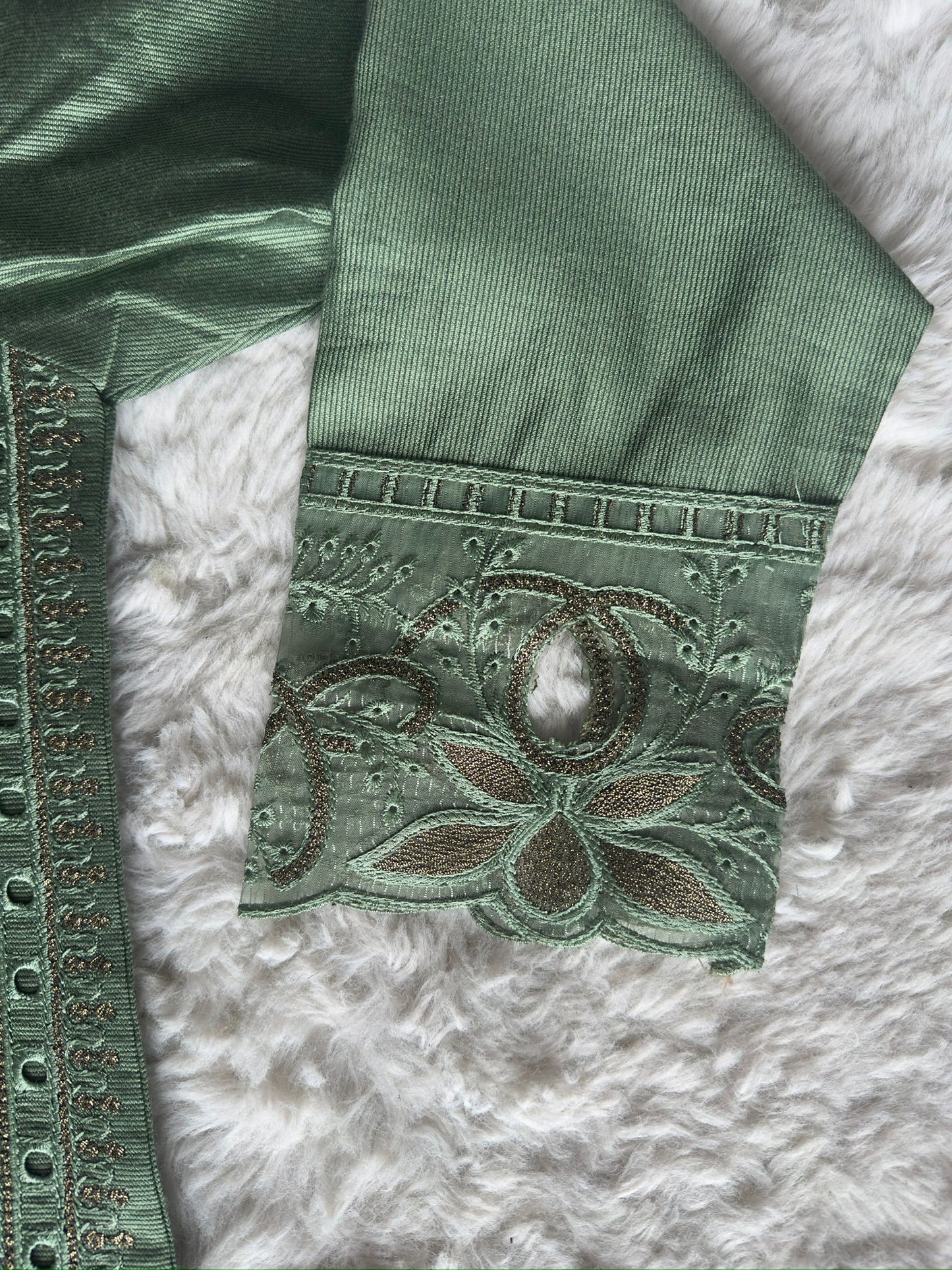 Elegant sage green luxury kurta showcasing intricate cut-work embroidery, zari highlights and a soft organza net dupatta by RUHKÉ