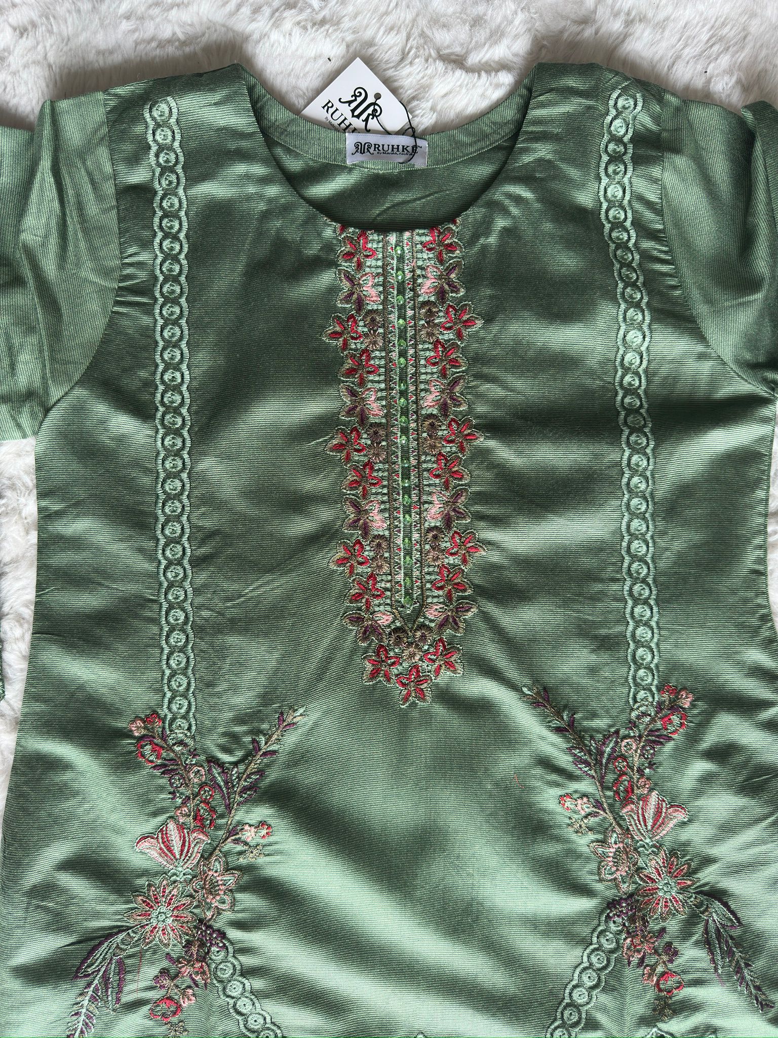 Premium sage green cut-work kurta showcasing floral thread embroidery and an elegant silk dupatta for refined festive wear by RUHKÉ