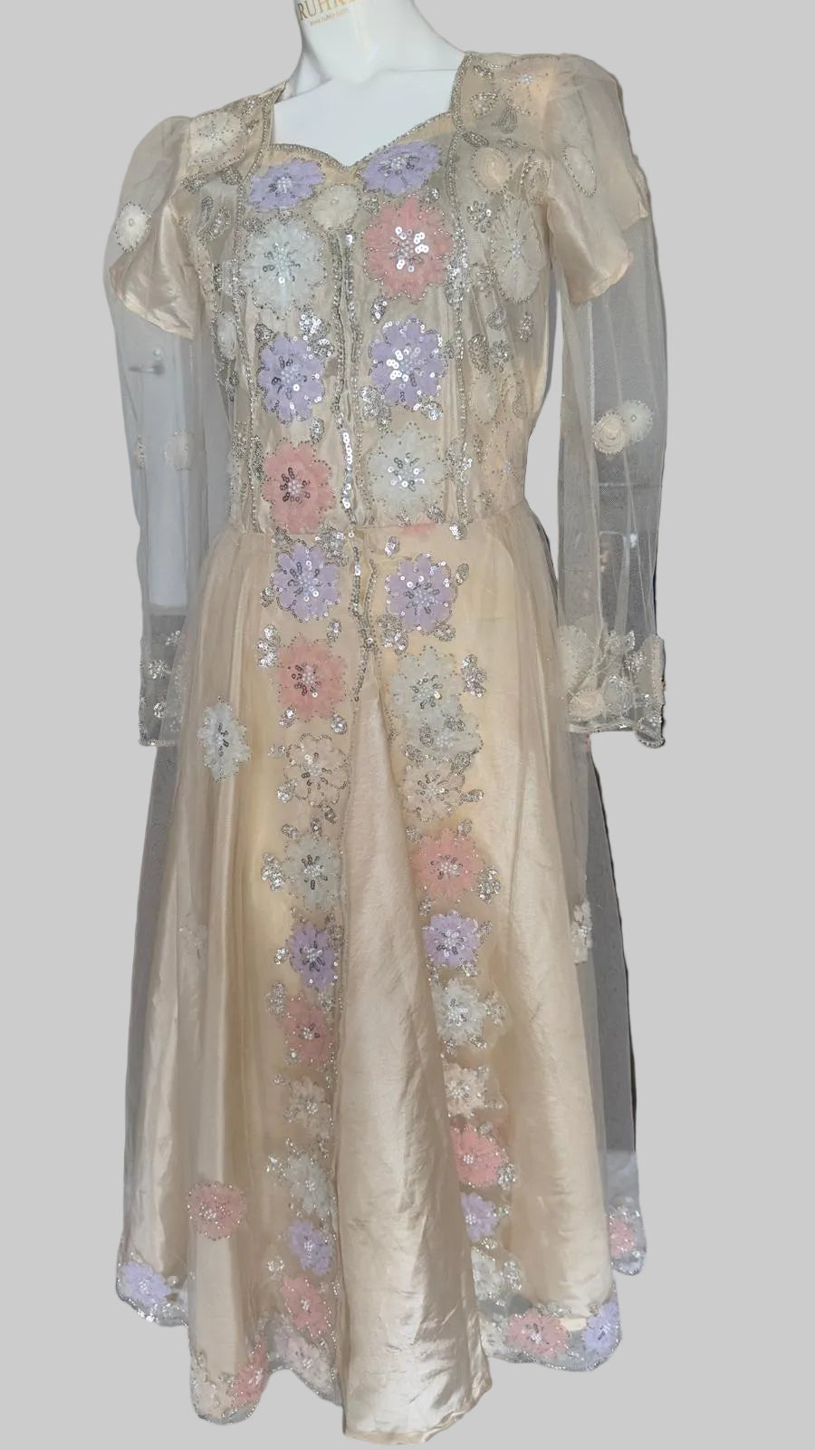 Luxury beige embellished dress featuring pearl work and handcrafted floral details