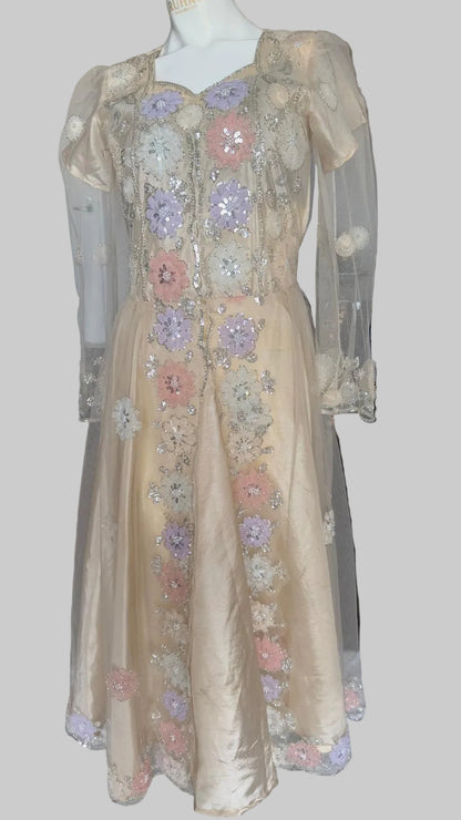 Luxury beige embellished dress featuring pearl work and handcrafted floral details