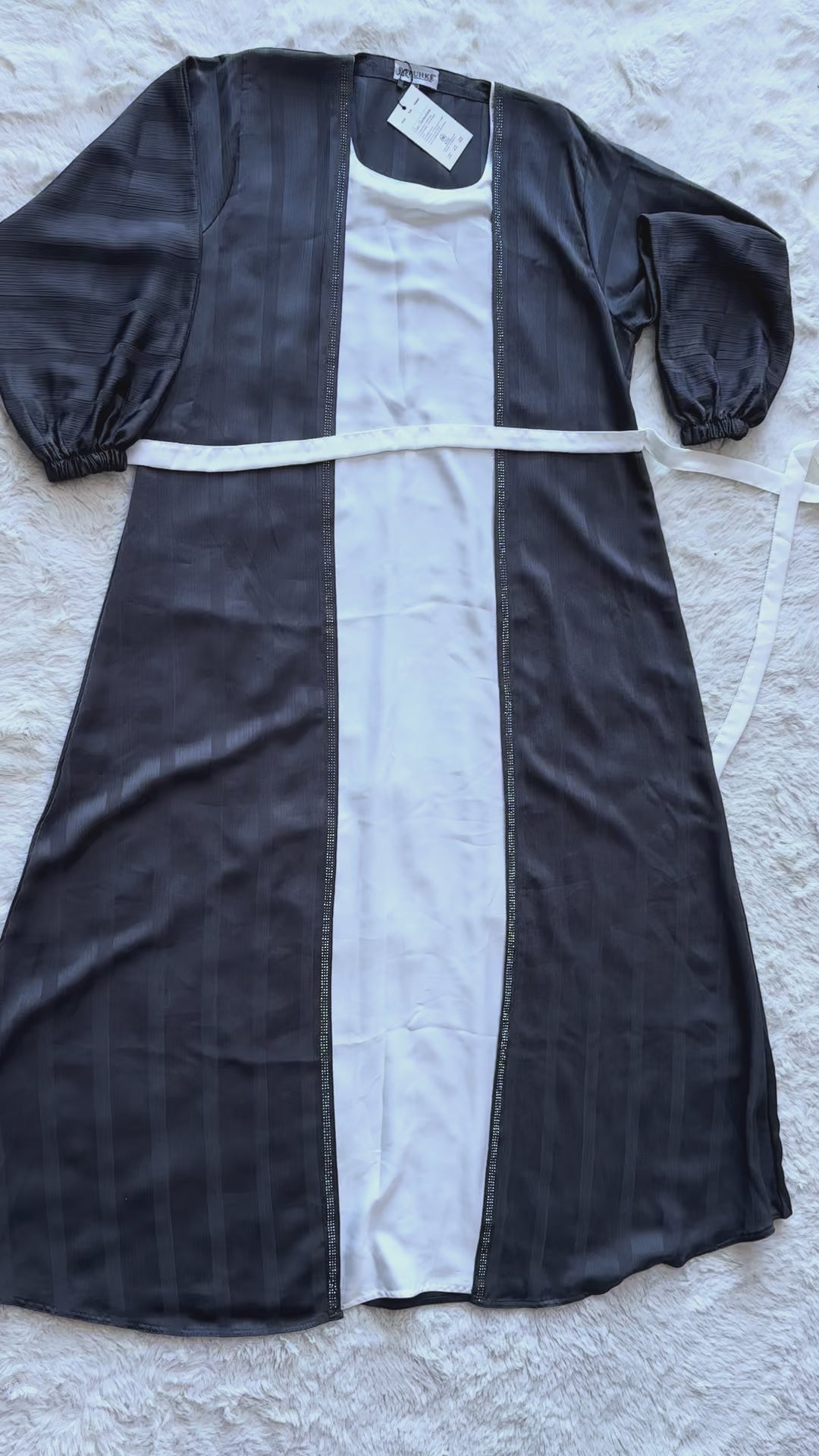 Charcoal grey silk abaya with textured finish and sophisticated flared design video