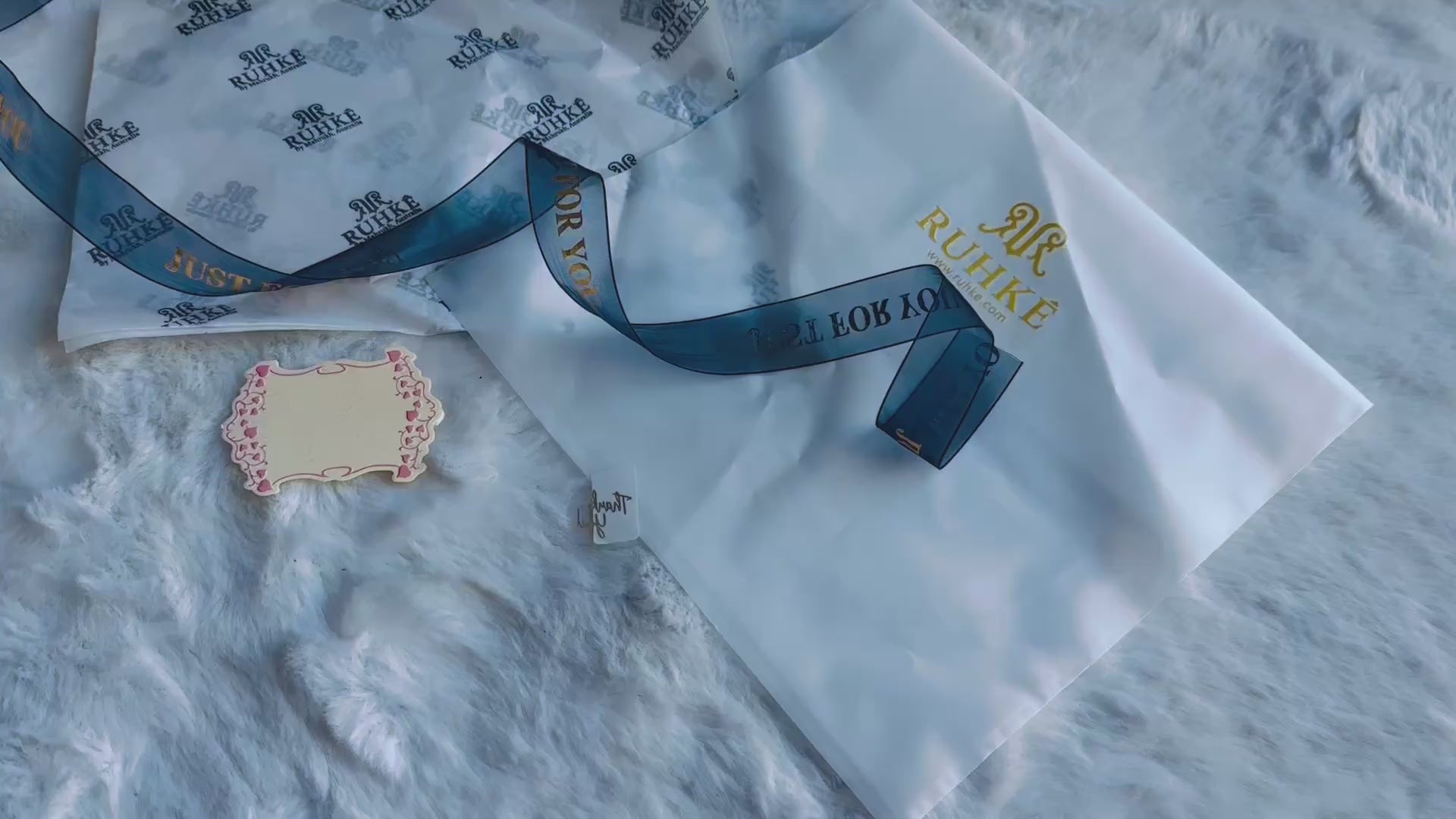 High-end luxury packaging showcasing RUHKÉ signature branding Video