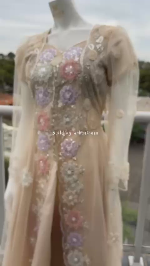 Close-up of pearl, sequin and glass bead floral embroidery on beige net dress video