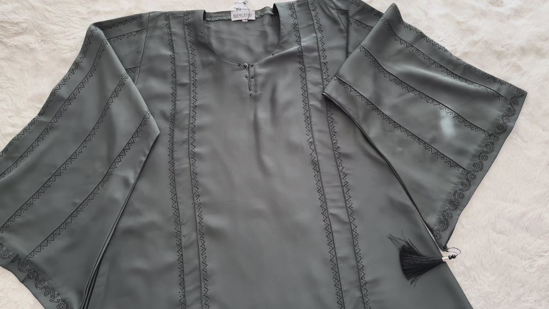 Smooth nida fabric texture of RUHKÉ luxury olive grey abaya Video