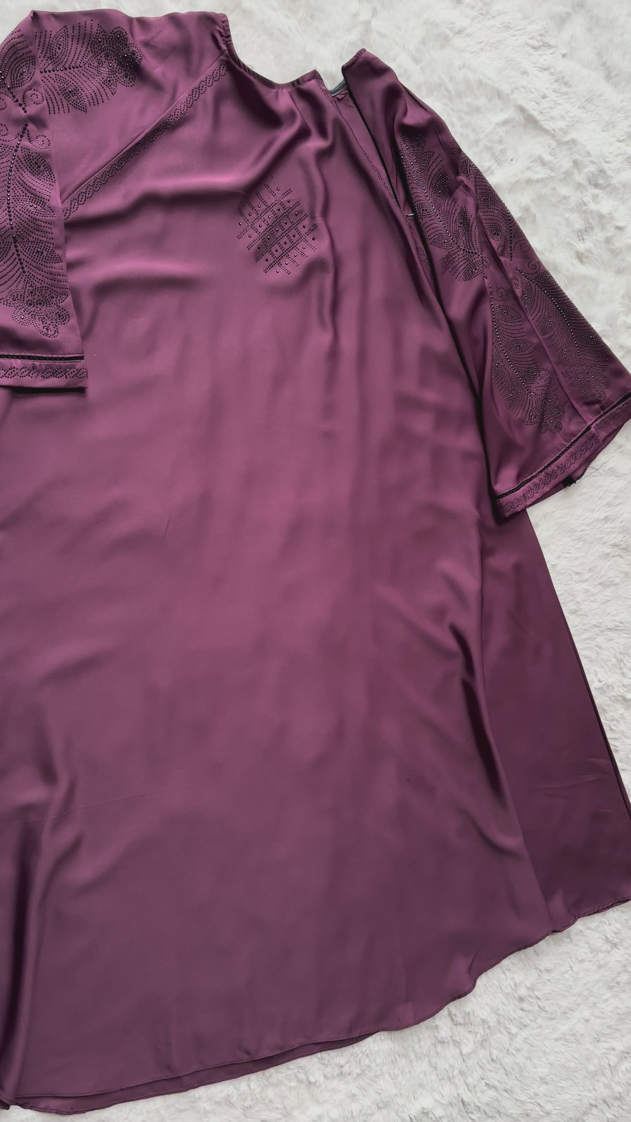 Full length plum luxury abaya crafted from premium Nida fabric with soft drape and elegant flare design video