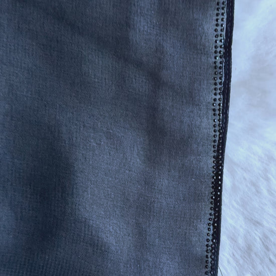 Exclusive black flared crêpe silk abaya representing designer modest fashion in video