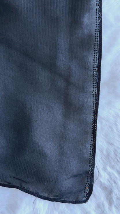 Exclusive black flared crêpe silk abaya representing designer modest fashion in video