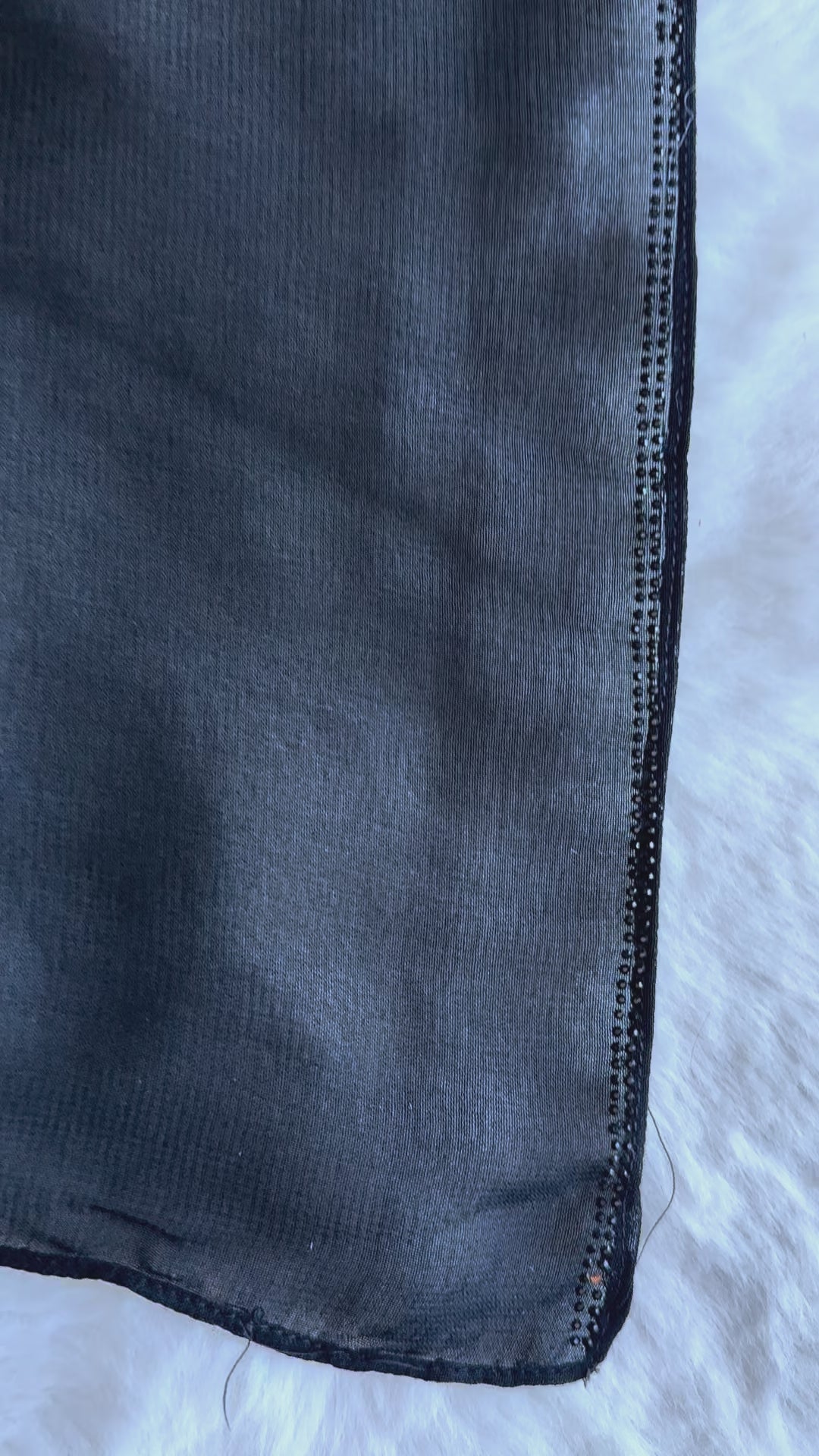 Exclusive black flared crêpe silk abaya representing designer modest fashion in video