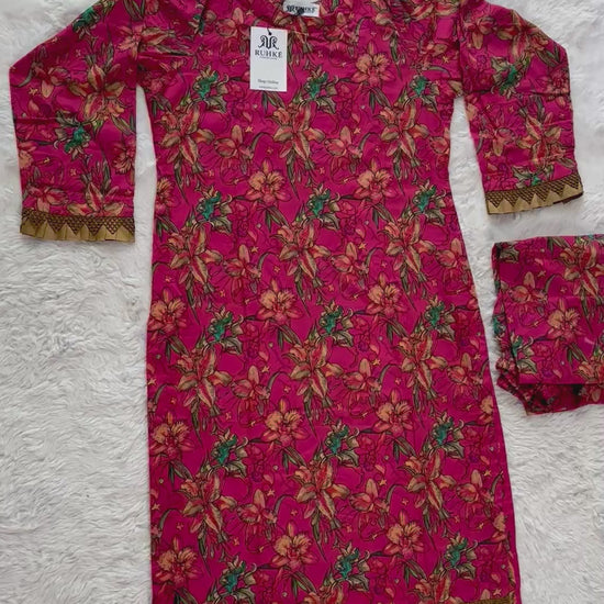 Video showcasing printed lawn shirt and trouser with lace patch details