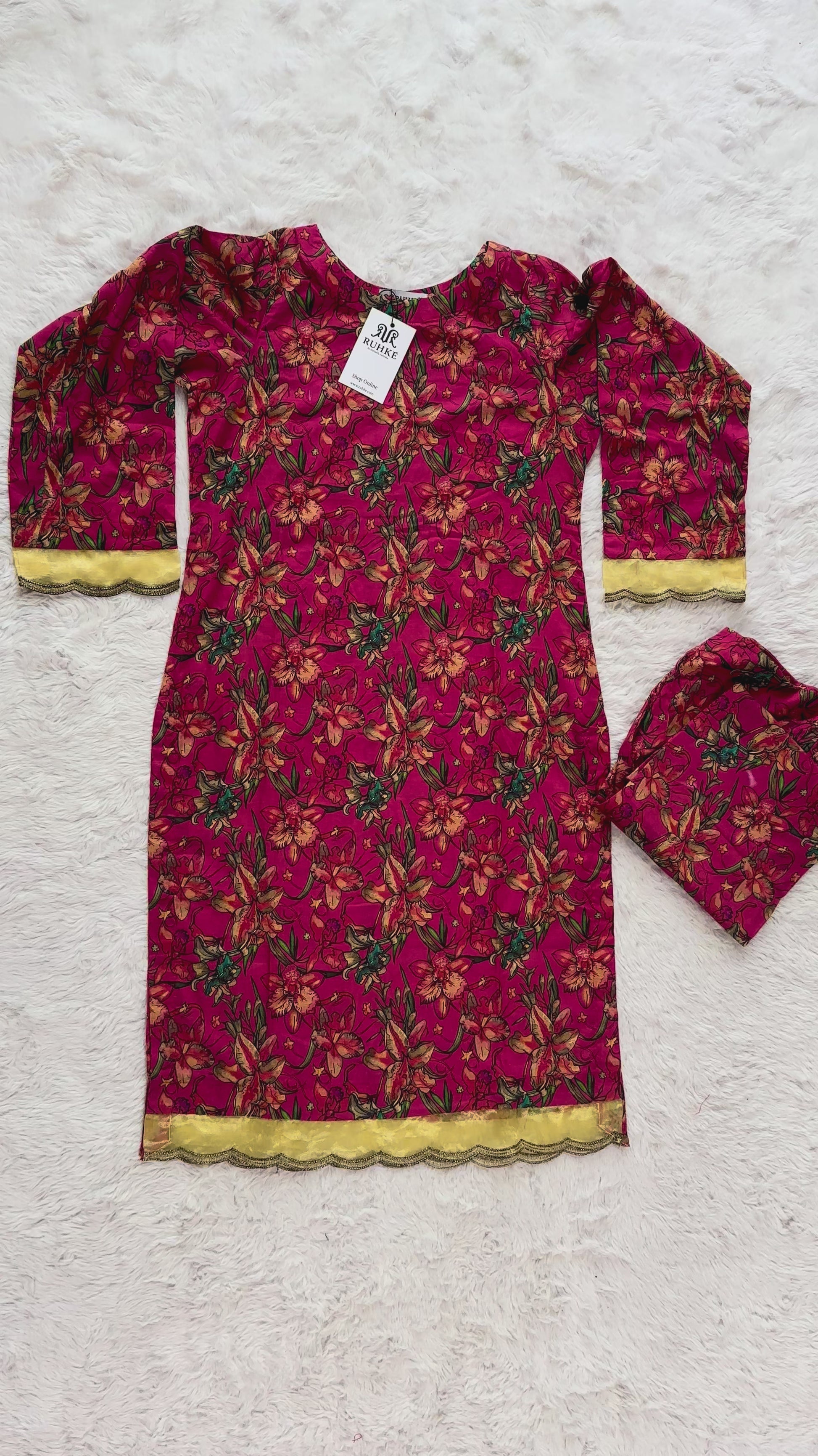 Flat lay of printed lawn 2 piece suit including shirt and trouser