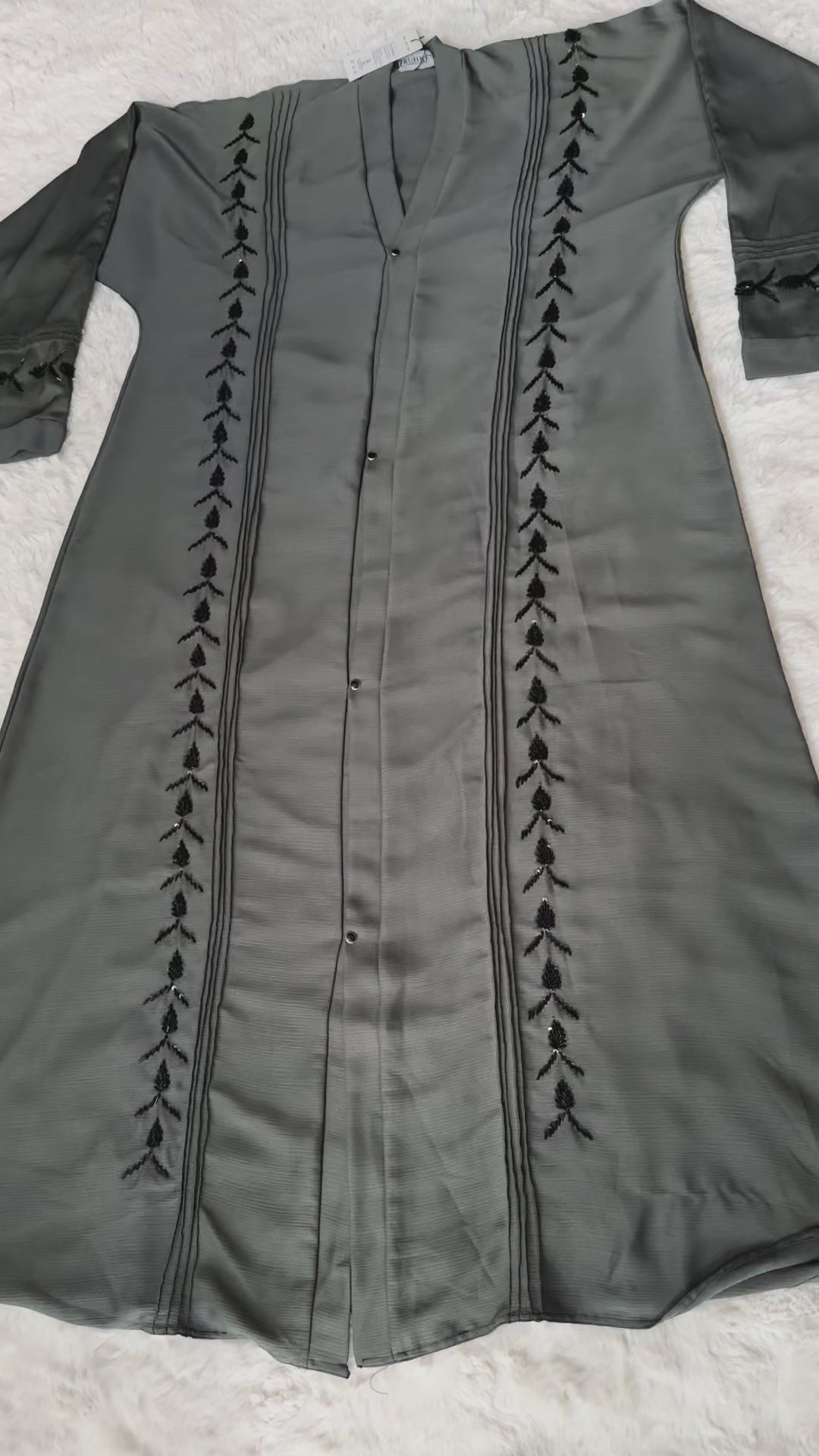 Textured crepe front open abaya with black beadwork detailing Video